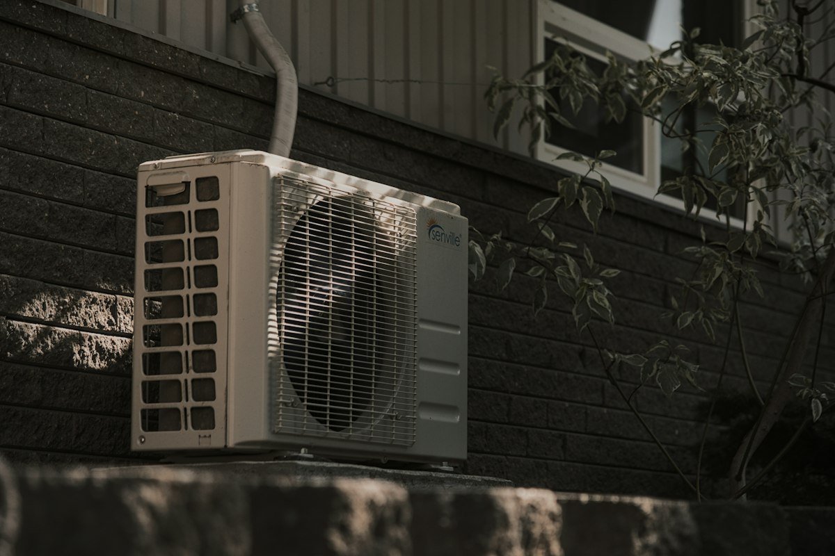 Outdoor air conditioning unit serviced during an AC repair visit
