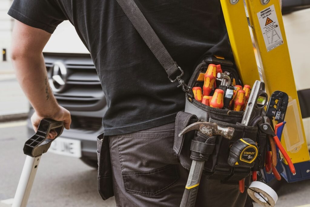 Technician holding a power tool for heating system service